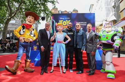 LONDON, ENGLAND - JUNE 16:  (L-R) Woody, Mark Nielsen, Bo Peep, Josh Cooley, Tom Hanks, Jonas Rivera and Buzz Lightyear attend the European premiere of Disney and Pixar's "Toy Story 4" at the Odeon Luxe Leicester Square on June 16, 2019 in London, England. (Photo by Gareth Cattermole/Getty Images for Disney and Pixar)