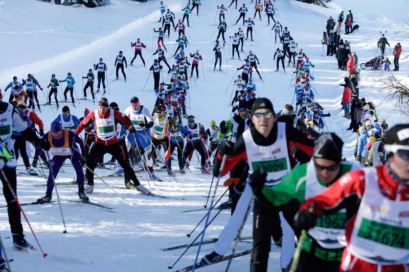 The pack passes by St Moritz during the Engadin cross-country Skimarathon on Sunday. Arno Balzarini / EPA / March 9, 2014