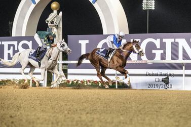 Jockey Sam Hitchcott guides Es Ajeeb to victory at Meydan Racecourse on Thursday night. Antonie Robertson / The National
