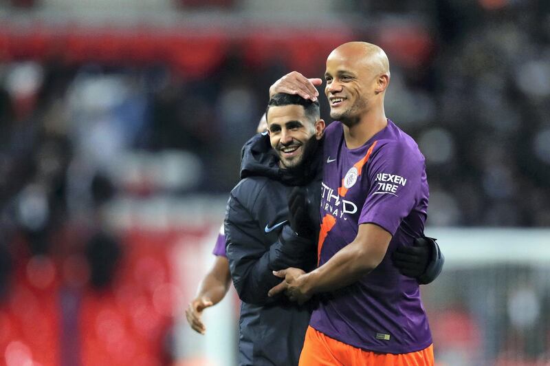 LONDON, ENGLAND - OCTOBER 29:  Riyad Mahrez and Vincent Kompany of Manchester City celebrates victory following the Premier League match between Tottenham Hotspur and Manchester City at Wembley Stadium on October 29, 2018 in London, United Kingdom.  (Photo by Catherine Ivill/Getty Images)