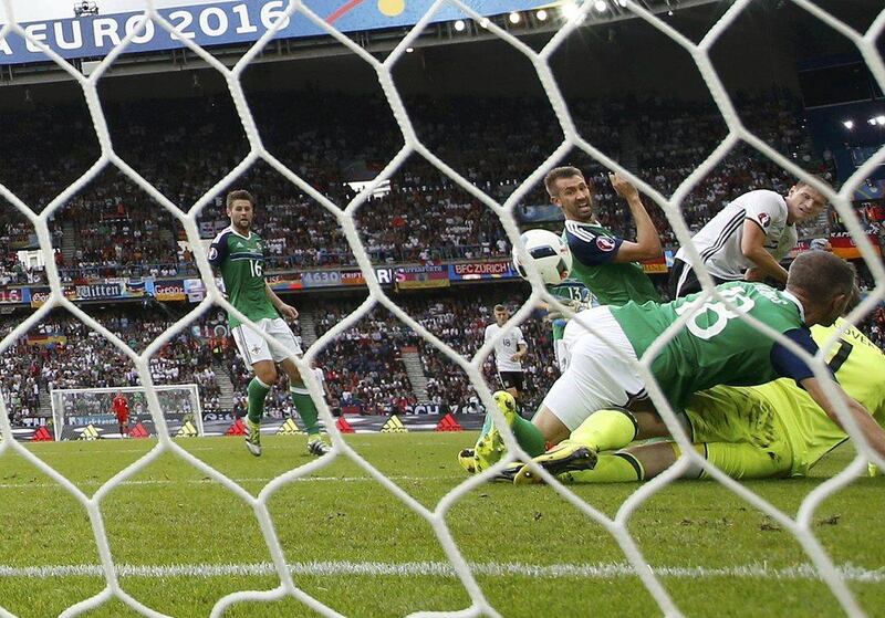 Mario Gomez, right, scores for Germany. REUTERS/John Sibley