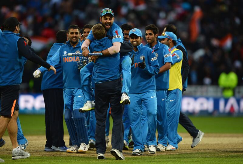 BIRMINGHAM, ENGLAND - JUNE 23: Virat Kohli of India celebrates victory with team mates during the ICC Champions Trophy Final between England and India at Edgbaston on June 23, 2013 in Birmingham, England.  (Photo by Gareth Copley/Getty Images) *** Local Caption ***  171219399.jpg