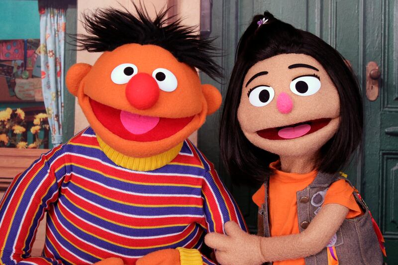 Ernie from 'Sesame Street' appears with new character Ji-Young, the first Asian-American muppet, on the set of the long-running children's programme. AP