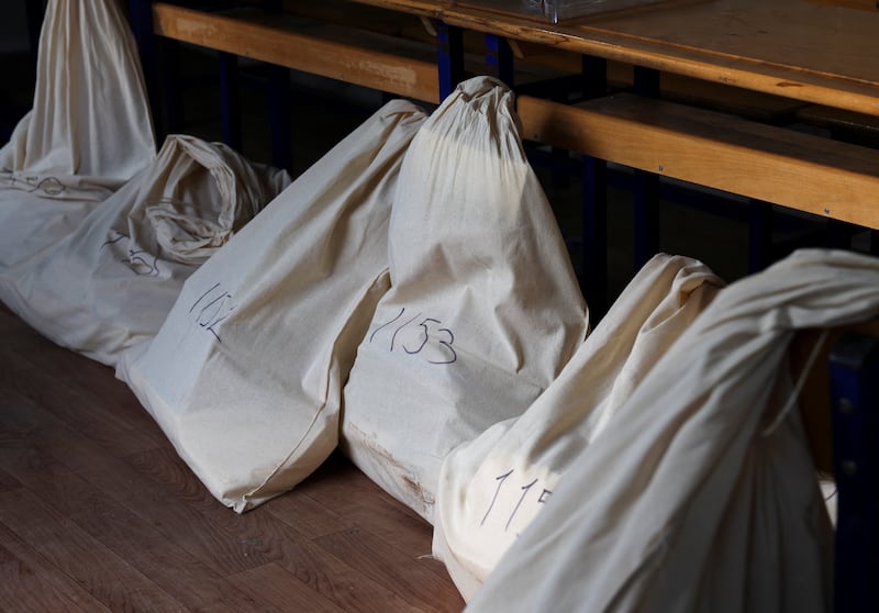 Bags containing blank ballots are stored at a temporary polling station in the courtyard of a quake-damaged school in Hatay. Reuters 