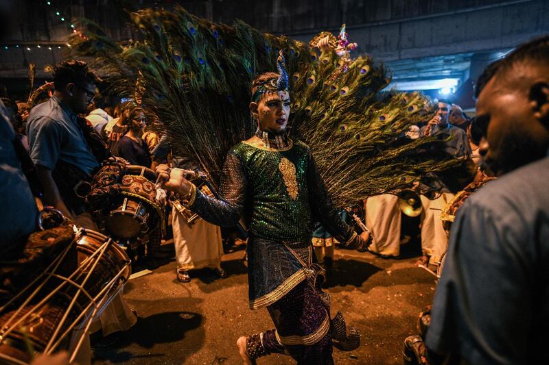 A Hindu devotee dancing in a state of trance before heading towards the Batu Caves temple to make offerings during the Thaipusam festival in Batu Caves on the outskirts of Kuala Lumpur.  AFP