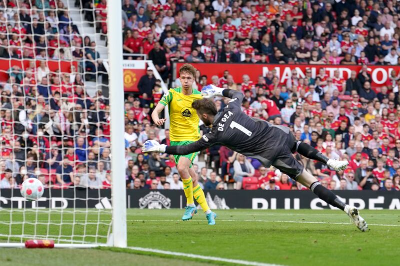 Norwich City's Kieran Dowell scores past goalkeeper David de Gea. AP