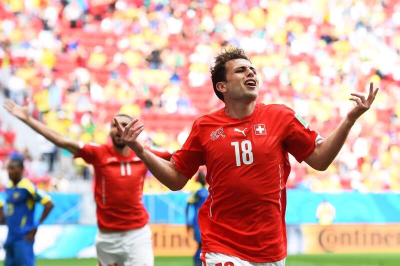 Admir Mehmedi of Switzerland celebrates scoring his team's first goal against Ecuador on Sunday at the 2014 World Cup. Stu Forster / Getty Images