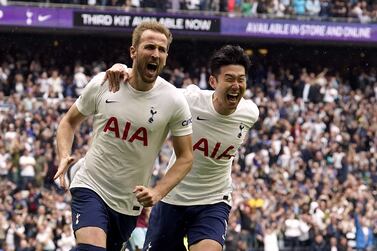 Tottenham Hotspur's Harry Kane celebrates scoring their side's first goal of the game from the penalty spot with team-mate Son Heung-min (right) during the Premier League match at the Tottenham Hotspur Stadium, London. Picture date: Sunday May 15, 2022.