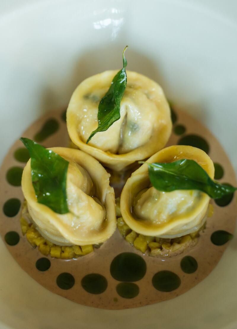 Langoustine dumplings with yam and curry leaf.