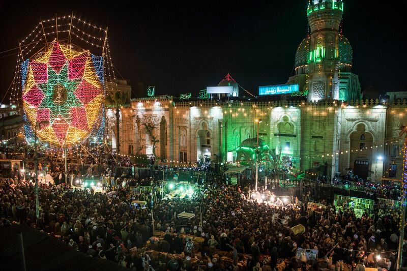 People celebrate during an annual Al-Sayeda Zeinab Mawlid celebration in Cairo, Egypt.  EPA