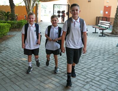 Pupils arrive for the first day of term at Raha International School in Abu Dhabi. Victor Besa / The National