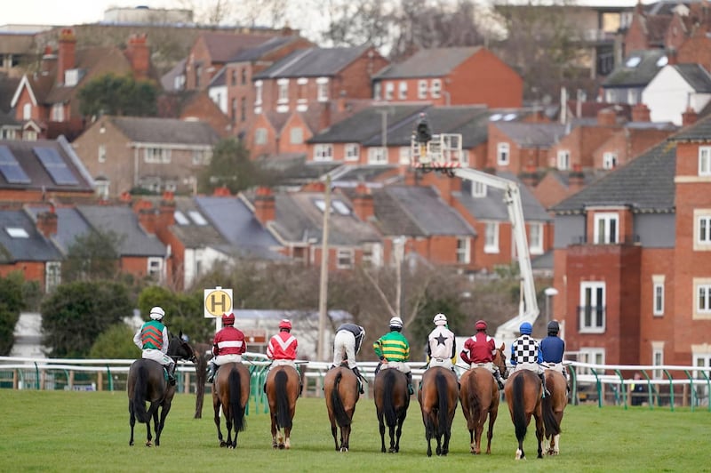 Runners and riders line up before the Visit racingtv.com Handicap Hurdle at Warwick Racecourse in England on Wednesday, February 3. PA