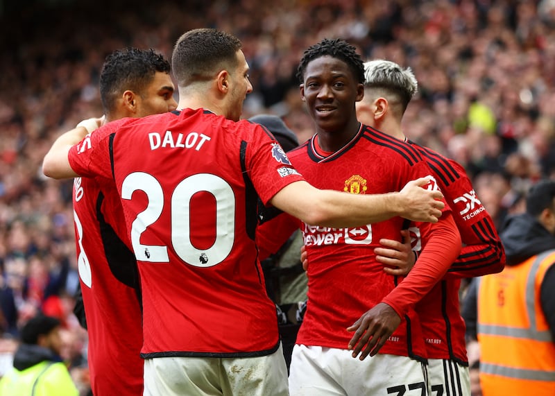  Manchester United's Kobbie Mainoo celebrates scoring their second goal with Diogo Dalot and Casemiro. Reuters