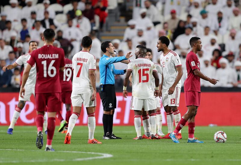 Abu Dhabi, United Arab Emirates - January 29, 2019: The UAE team argue with the ref during the semi final between the UAE and Qatar in the Asian Cup 2019. Tuesday, January 29th, 2019 at Mohamed Bin Zayed Stadium Stadium, Abu Dhabi. Chris Whiteoak/The National