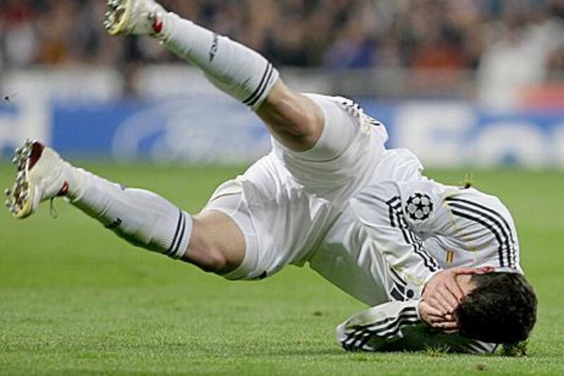 Real Madrid's Gonzalo Higuain tumbles over during a draw with Lyon last March.