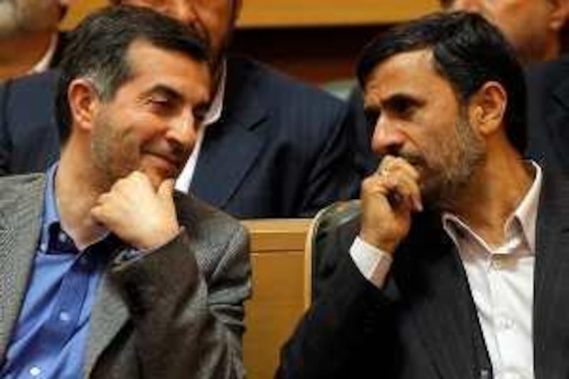 (FILES) A picture taken on April 14, 2009 shows Iranian President Mahmoud Ahmadinejad (R) sitting next to his aide Esfandiar Rahim Mashaie (L) as they attend the Iranian expatriates summit in Tehran. Ahmadinejad has appointed Mashaie as the country's new first vice president, the official IRNA news agency reported on July 17, 2009. Mashaie, a confidant of Ahmadinejad, is a controversial figure who last year was rapped by the country's hardliners and by supreme leader Ayatollah Ali Khamenei for saying Iran is a "friend of the Israeli people." AFP PHOTO/BEHROUZ MEHRI *** Local Caption ***  422640-01-08.jpg