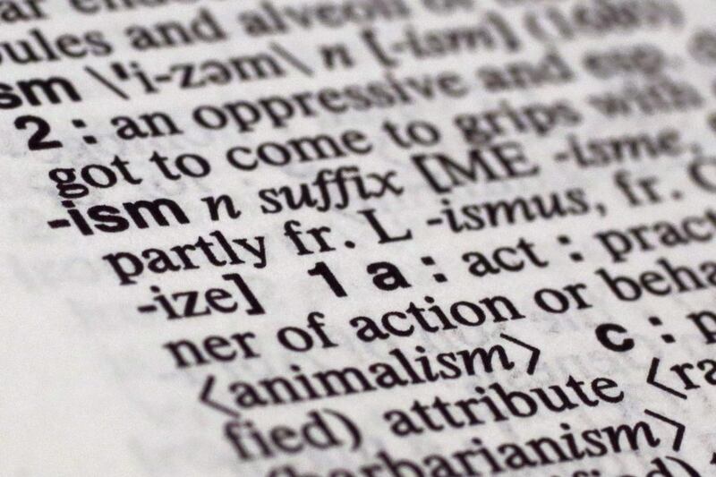 Merriam-Webster has picked a small but powerful suffix as word of the year: ism. The top isms to earn high traffic spikes and big bumps in lookups on the dictionary company’s website in 2015. Richard Drew / AP photo