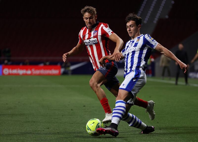 Real Sociedad midfielder Martin Zubimendi in action against Atletico Madrid's Marcos Llorente. EPA