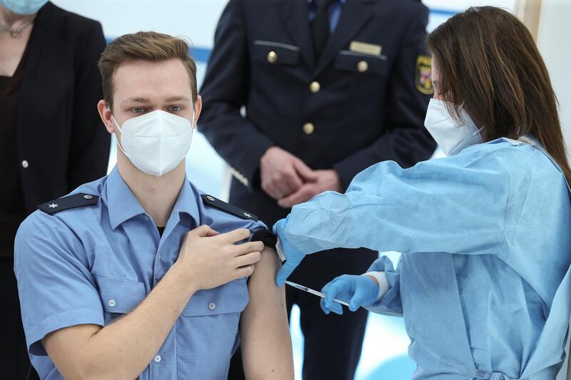 A German police officer receives a dose of AstraZeneca's vaccine in Mainz, Germany. Reuters