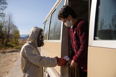 An official checks the temperature of a traveller at the entrance to Wonsan city in North Korea. AFP