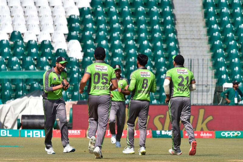 Lahore Qalandars players celebrate the wicket of Zeeshan Ashraf. AFP