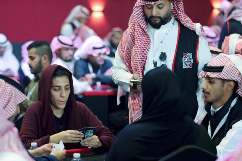 Women play a popular card game Baloot, as Saudi Arabian women join a local tournament for the first time, in Riyadh. Reuters