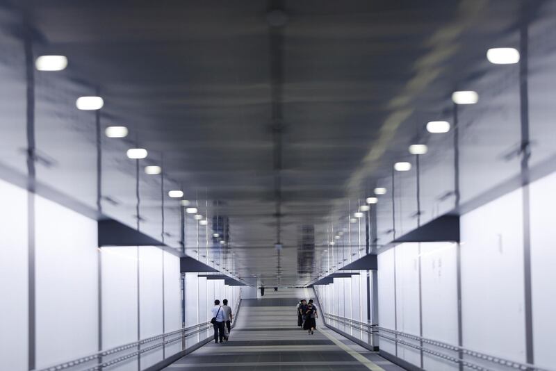 Passengers wearing protective face masks are seen at the concourse amid the coronavirus disease (COVID-19) outbreak, at Tokyo Metro's newly-opened Toranomon Hills Station in Tokyo, Japan. REUTERS