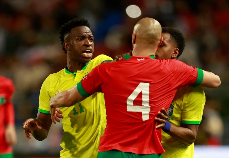 Brazil attackers Vinicius Junior and Rodrygo argue with Morocco's Sofyan Amrabat. Reuters