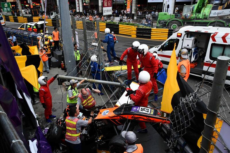 Race personnel and pit crew are seen at the accident site after Sophia Floersch, a German driver of Van Amersfoort Racing flew over the barriers and crashed into a photographers' bunker at high speed, during a Formula Three race at the Macau Grand Prix, in Macau, China November 18, 2018. Mai Shangmin/CNS via REUTERS ATTENTION EDITORS - THIS IMAGE WAS PROVIDED BY A THIRD PARTY. CHINA OUT. TPX IMAGES OF THE DAY 