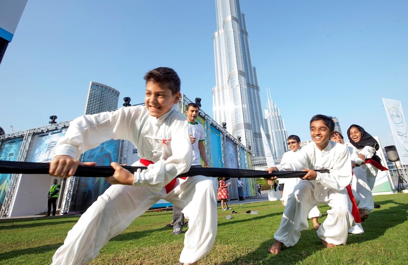 DUBAI, UNITED ARAB EMIRATES - Tug of war at the closing weekend carnival of the second year of the Dubai Fitness Challenge at Burj Park, Dubai.  Leslie Pableo for The National