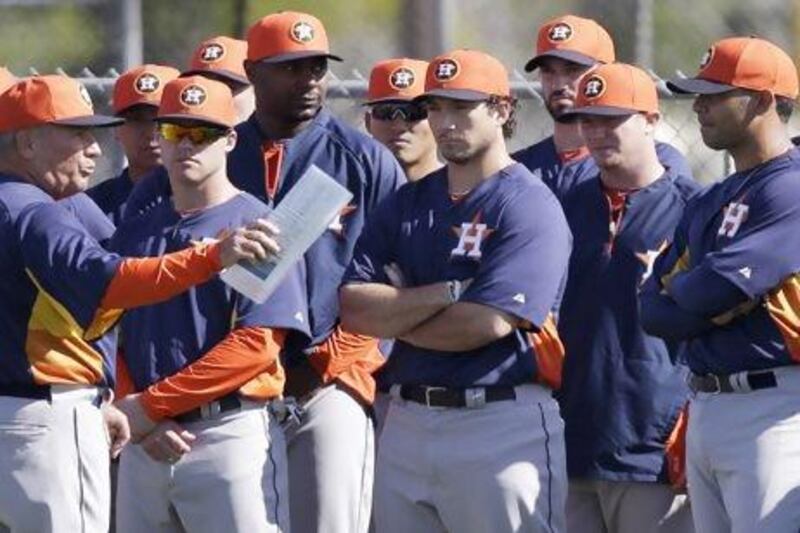 Houston Astros third base coach Dave Trembley talks to the players during a spring training session. David Phillip / AP Photo