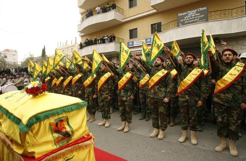 Hizbollah fighters are seen attending the funeral of a comrade who died in combat in Syria on March 18, 2017. Mahmoud Zayyat / AFP