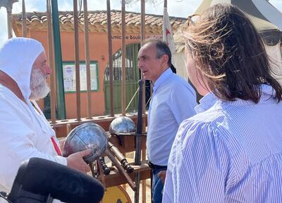Far-right candidate Eric Zemmour tours a medieval fair in Bormes-les-Mimosa, France. Photo: Joelle Randall