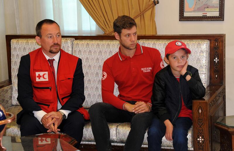 TOPSHOT - A handout picture released by the official Syrian Arab News Agency (SANA) on November 7, 2019, shows 11-year-old boy Alvin (R) at a meeting to hand him over to representatives of the International Federation of Red Cross and Red Crescent Societies (IFRC) in the Syrian capital Damascus. The Italian public has been avidly following he story of 11-year-old Alvin, born in Italy to Albanian parents, since it emerged last month he was living in a Kurdish-held camp in northeastern Syria. A media report aired in October showed the emotional reunion between the boy and his father in the Al-Hol camp housing thousands of family members of suspected IS fighters. -  == RESTRICTED TO EDITORIAL USE - MANDATORY CREDIT "AFP PHOTO / HO / SANA" - NO MARKETING NO ADVERTISING CAMPAIGNS - DISTRIBUTED AS A SERVICE TO CLIENTS ==
 / AFP / SANA / - /  == RESTRICTED TO EDITORIAL USE - MANDATORY CREDIT "AFP PHOTO / HO / SANA" - NO MARKETING NO ADVERTISING CAMPAIGNS - DISTRIBUTED AS A SERVICE TO CLIENTS ==
