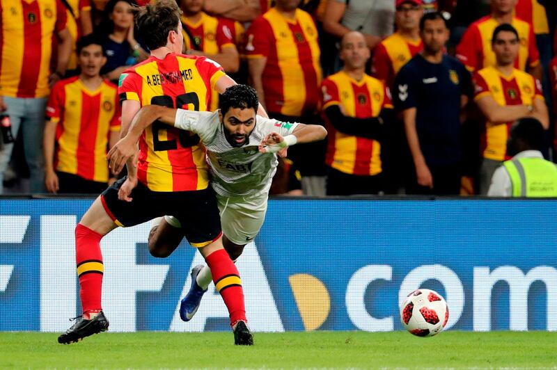 Al Ain's Mohammed Fayez, right, fights for the ball with ES Tunis' Aymen Ben Mohamed. AFP