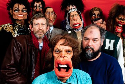 LONDON - APRIL 1: Spitting Image, a British satirical television programme. Creators (L) Peter Fluck and (R) Roger Law, in their London Studio in April 1, 1986. They are posing with the caricature puppets of Michael Jackson, Sylvester Stallone, Prince Charles, Cher, Queen Elizabeth II, Nancy Reagan, Walter Matthau, Tina Turner and Mick Jagger. (Photo by David Levenson/Getty Images)