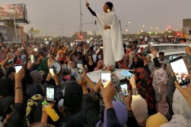 A Sudanese woman gestures during a protest demanding Sudanese President Omar Al Bashir to step down along a bridge in Khartoum, Sudan April 8, 2019. Courtesy Lana H Haroun