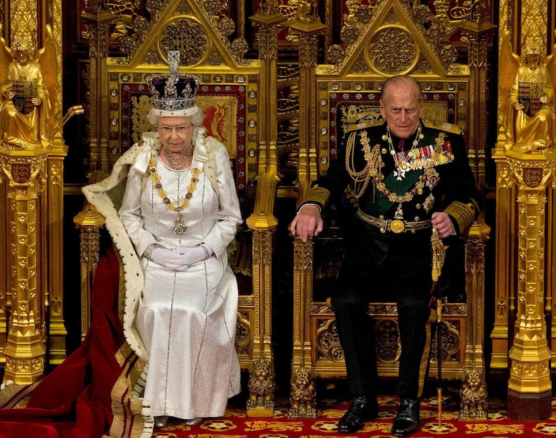 Britain's Queen Elizabeth II sits next to Prince Philip in the House of Lords as she waits to read the Queen's Speech to MPs in London on May 9, 2012.  AP Photo