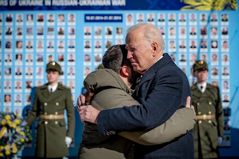 The two presidents embrace each other at a wreath-laying ceremony at the Wall of Remembrance of the Fallen for Ukraine, in Kyiv. EPA