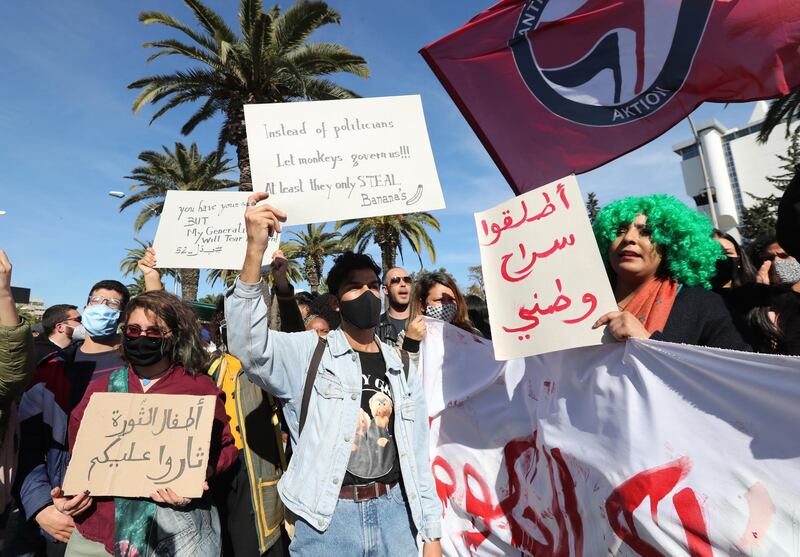 Tunisian anti-government protesters shout slogans during a demonstration in Tunis. EPA