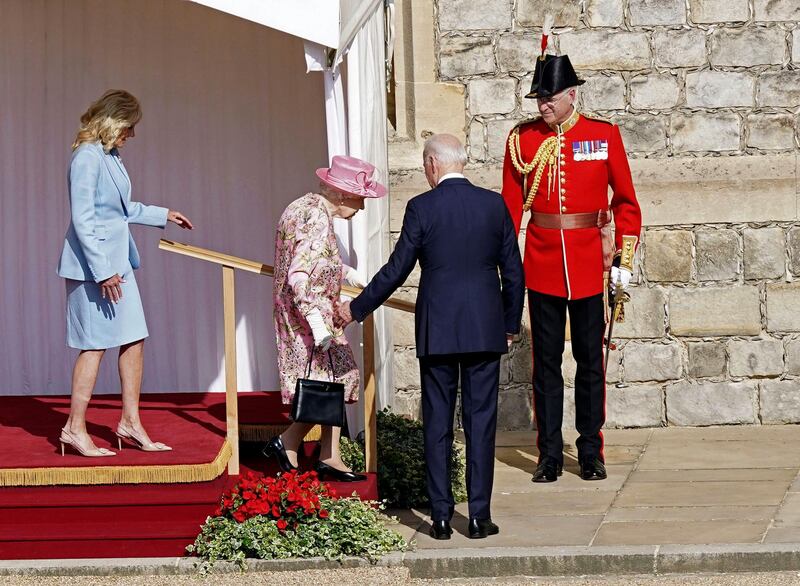 US President Joe Biden gestures to Britain's Queen Elizabeth II during a visit to Windsor Castle with First Lady Jill Biden. AP