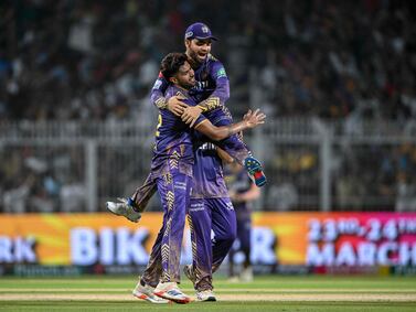 Kolkata Knight Riders' Harshit Rana and Rinku Singh (top) celebrate after winning the Indian Premier League (IPL) Twenty20 cricket match between Kolkata Knight Riders and Sunrisers Hyderabad at the Eden Gardens in Kolkata on March 23, 2024.  (Photo by DIBYANGSHU SARKAR  /  AFP)  /  -- IMAGE RESTRICTED TO EDITORIAL USE - STRICTLY NO COMMERCIAL USE --