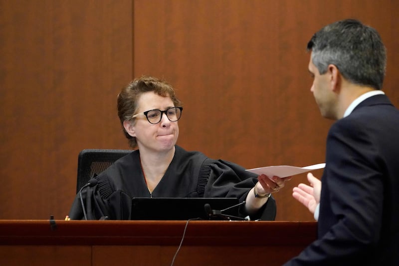 Judge Penney Azcarate speaks to an attorney in the courtroom during the Johnny Depp-Amber Heard lawsuit. AFP