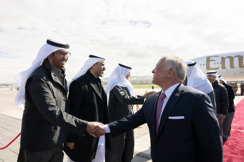 Dr Sultan Al Jaber, Minister of Industry and Advanced Technology, greets King Abdullah at Marka International Airport. 