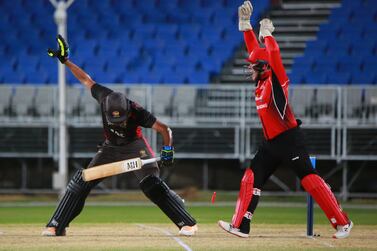 Hong Kong wicketkeeper Scott McKenchnie appeals for a stumping against UAE captain CP Rizwan. Courtesy ACC