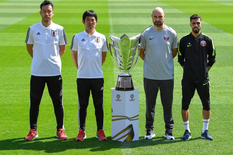 (L-R) Maya Yoshida of Japan and Japan Head coach Hajime Moriyasu and Qatar head coach Felix Sanchez Bas and Hasan Al Haydos of Qatar pose for photographs with Asian Cup trophy at Zayed Sports City Stadium in Abu Dhabi, United Arab Emirates. Getty Images