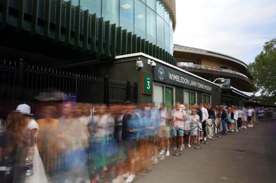 Spectators queue up outside the gates prior to day one of Wimbledon. Getty Images