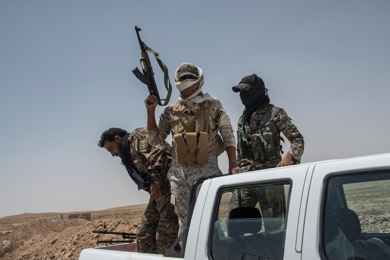 NINEVEH, IRAQ - JUNE 20: Iraqi PMF fighters on June 20, 2017 on the Iraq-Syria border in Nineveh, Iraq. The Popular Mobilisation Front (PMF) forces, composed of majority Shi'ite militia, part of the Iraqi forces, have pushed Islamic State militants from the north-western Iraq border strip back into Syria. The PMF now hold the border, crucial to the fall of Islamic State in Mosul, blocking the Islamic State supply route for militants from Syria to Mosul. (Martyn Aim/Getty Images).