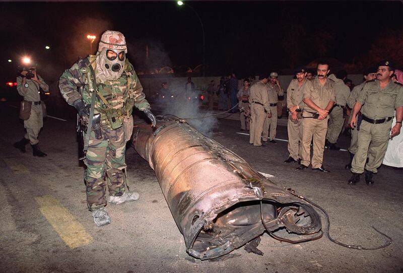 File photo of a US soldier, right, and Saudi police officers examine the wreck of a missile, believed to be a Soviet-made Scud, which landed in downtown Riyadh in January 1991 when Iraq launched a missile attack on the Saudi capital. 