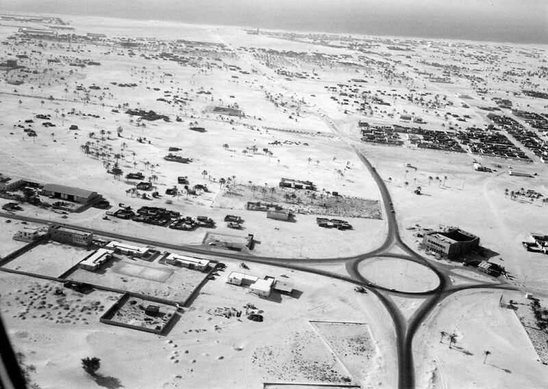 A roundabout in Deira with asphalt exits leading to sand roads not yet hardened, taken in the mid to late 1960s. Also shown is the new Deira Cinema under construction. Photo: Showpiece City: How Architecture Made Dubai, Stanford University Press; John R. Harris Library